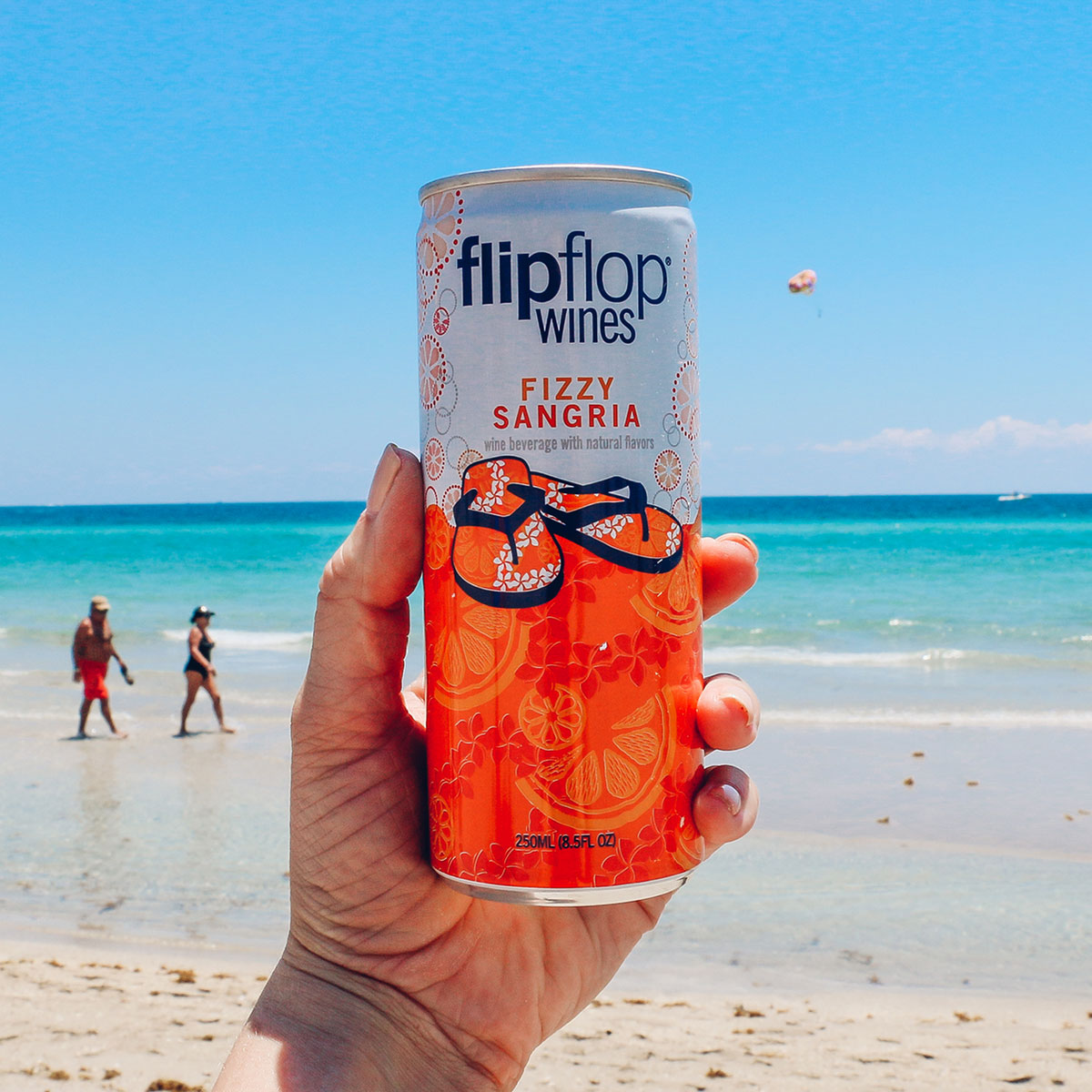 Adult spring break at the beach with flipflop wine